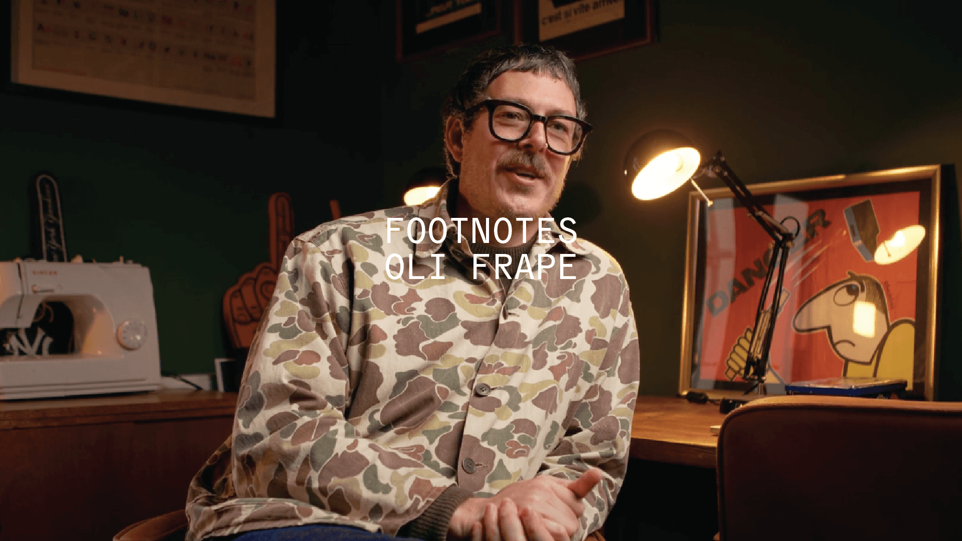 Illustrator Oli Frape in his studio, captioned ‘Footnotes – Oli Frape’