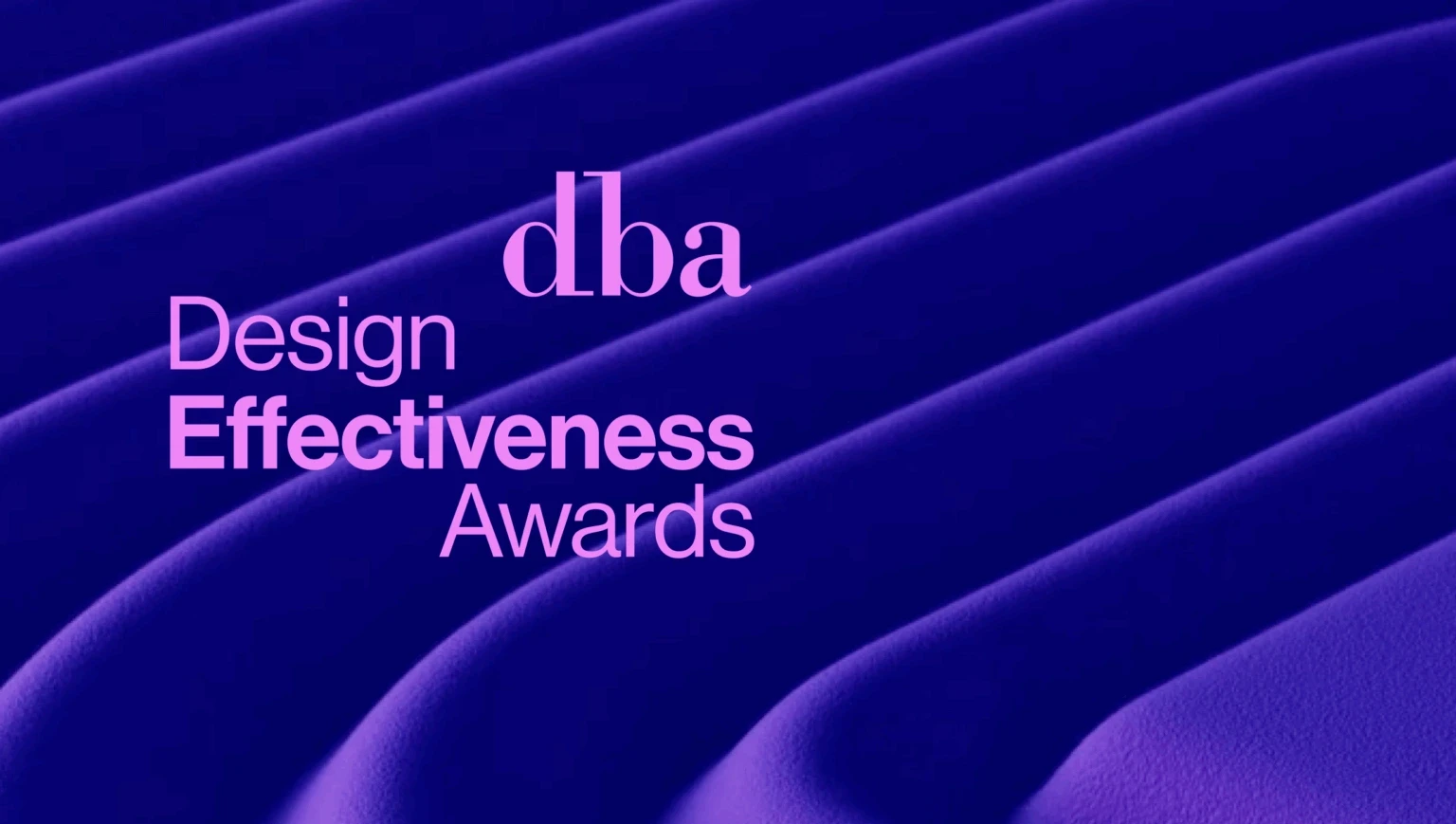 DBA Design Effectiveness Awards logo in pink over flowing violet ridges